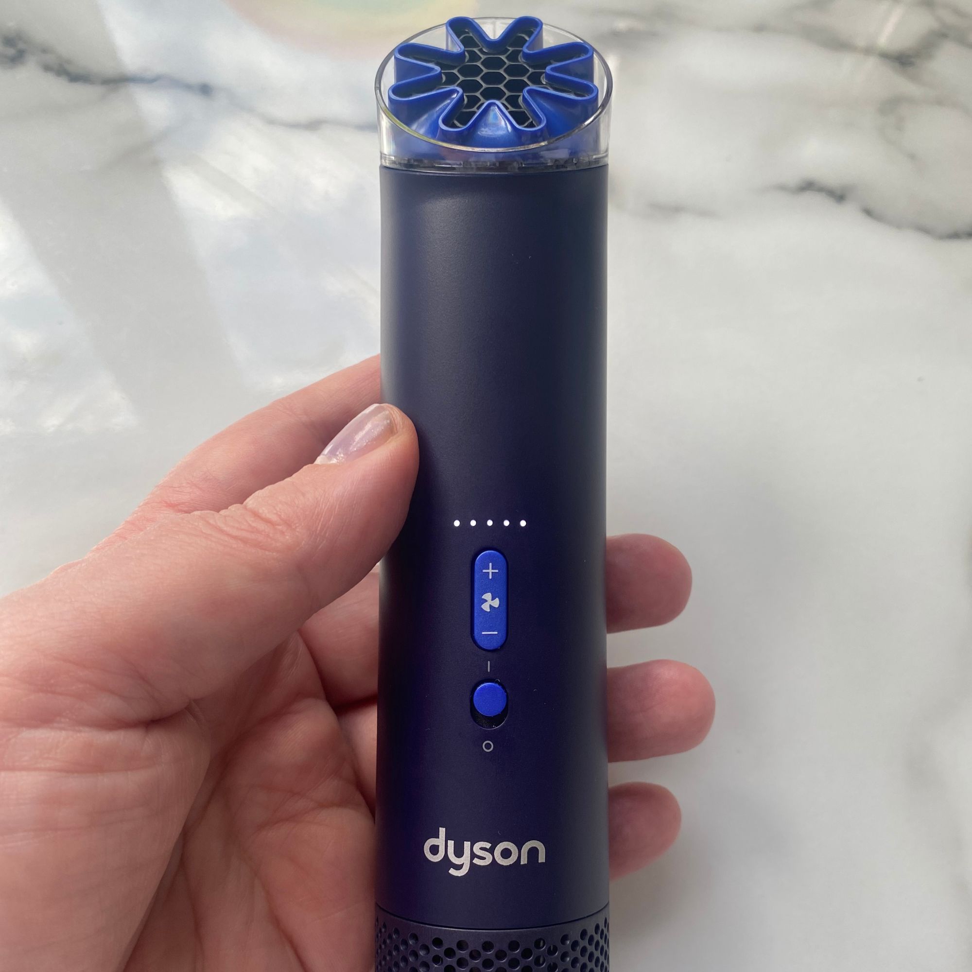 Holding the Dyson HushJet Mini Cool fan while it's in top speed mode