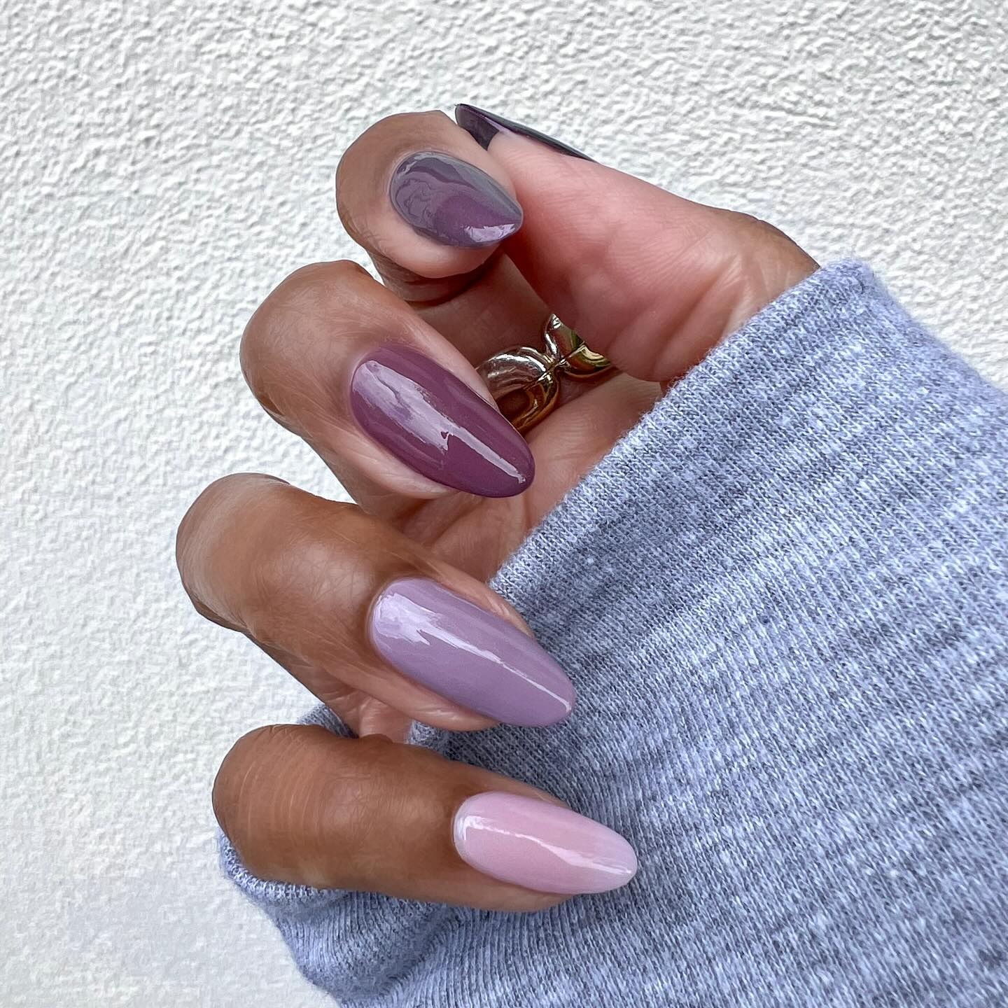 Person wearing ombré glaze purple nails.