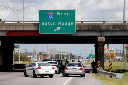 Baton Rouge police respond to a shooting attack on officers