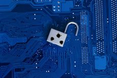 A security flaw depicted by a padlock with bullet holes on a circuit board