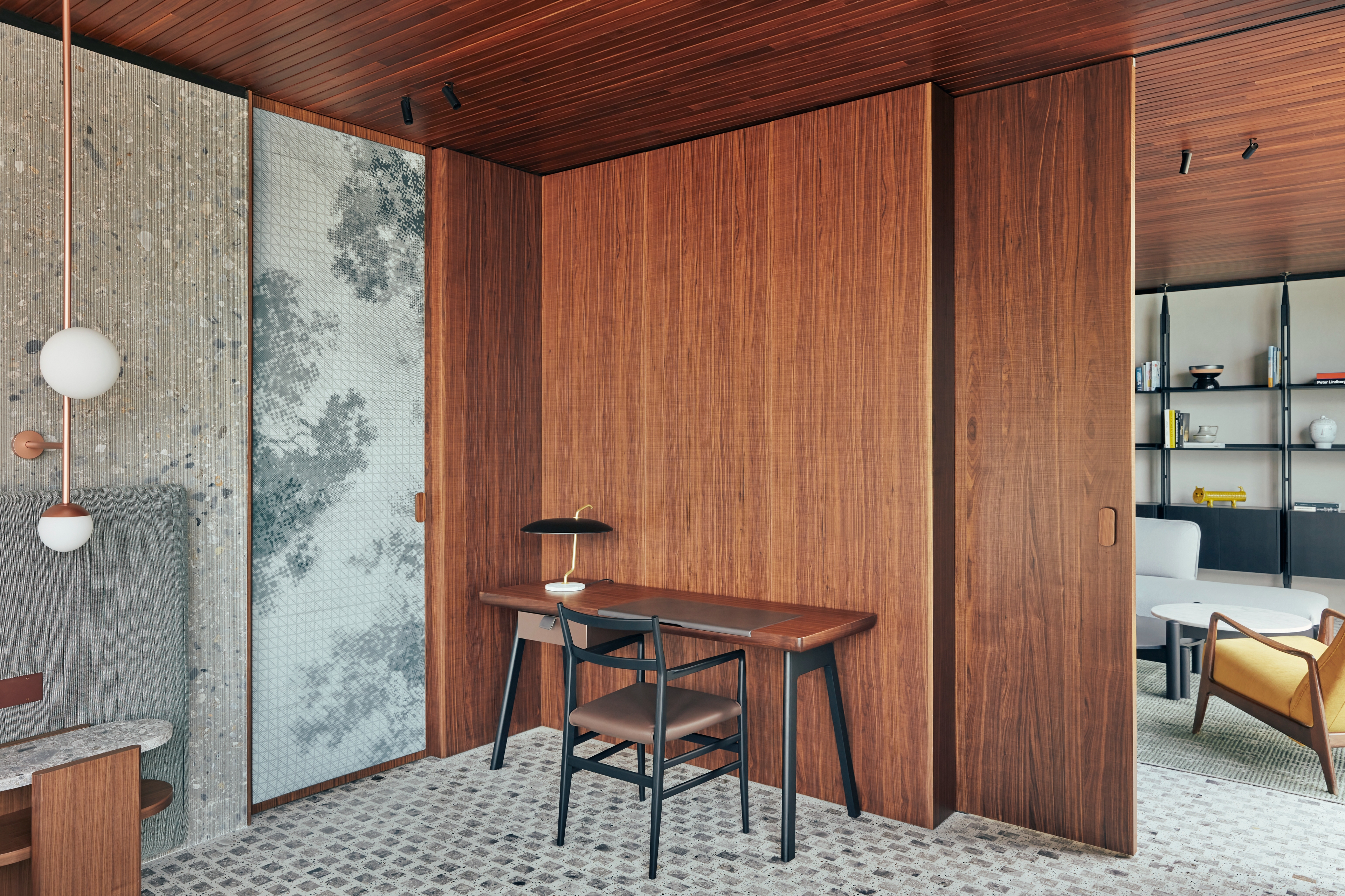 Il Sereno Hotel penthouse interior with walnut and ceppo di gre walls and terrazzo floors