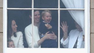 Prince George of Cambridge is held by his nanny Maria Teresa Turrion Borrallo as he waves from the window of Buckingham Palace as he watches the Trooping The Colour on June 13, 2015 in London, England
