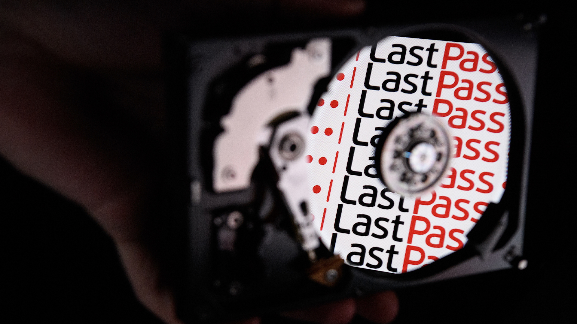 LastPass logo and branding reflected on the internal discs of a hard drive.