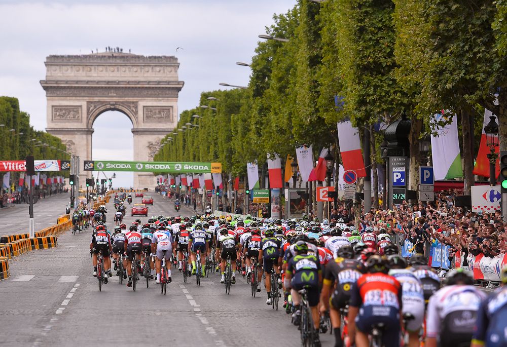 The Tour de France peloton heads toward the Arc de Triomphe during the final stage in Paris