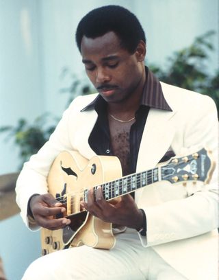 George Benson performing onstage circa 1976