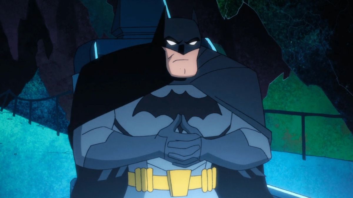 Batman sitting in front of the Batcomputer in Harley Quinn animated series