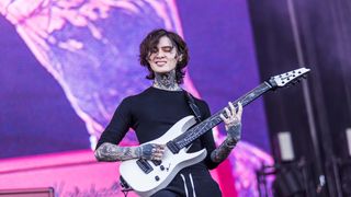 Tim Henson of Polyphia plays his signature Ibanez onstage at Rock AM Ring 2024.