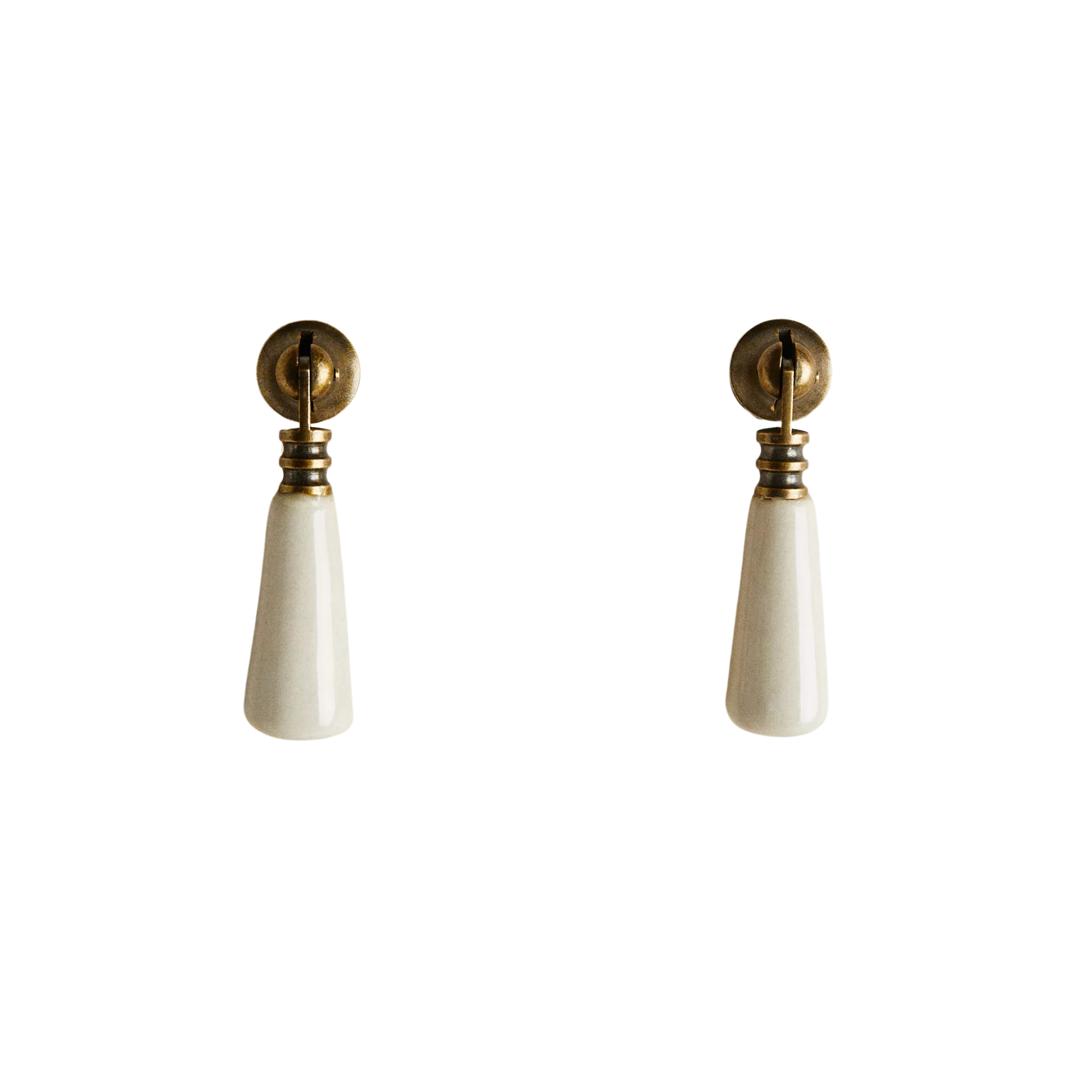 a metal and ceramic cabinet pull