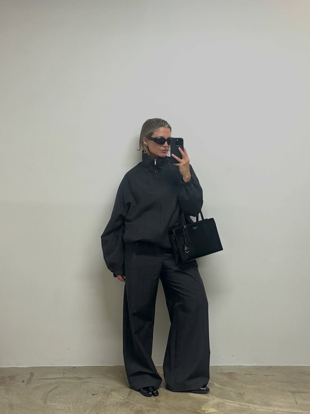 Influencer Alexis Foreman wearing a funnel-neck jacket.