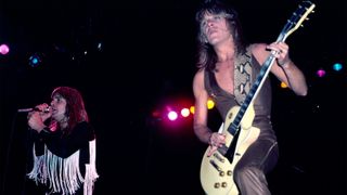 View of British Heavy Metal singer Ozzy Osbourne (left) and American musician Randy Rhoads (1956 - 1982), on guitar, as they perform, during the 'Blizzard of Ozz Tour,' at Nassau Coliseum, Uniondale, New York, August 14, 1981. It was Ozzy Osbourne's debut concert tour as a solo artist after having been fired by the English group Black Sabbath the year prior.