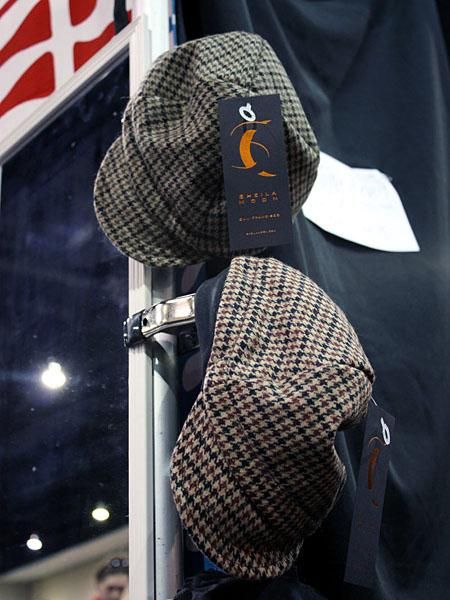 Sheila Moon doesn't only do women's gear, though, with men's clothing and unisex accessories such as these classy caps on display as well.