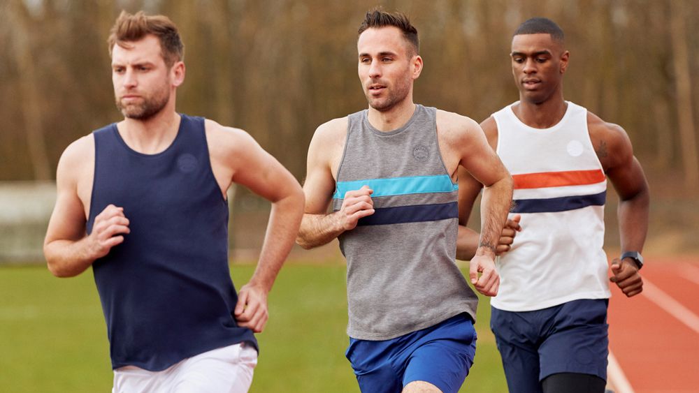 Three men running in Iffley Road singlets