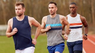Three men running in Iffley Road singlets
