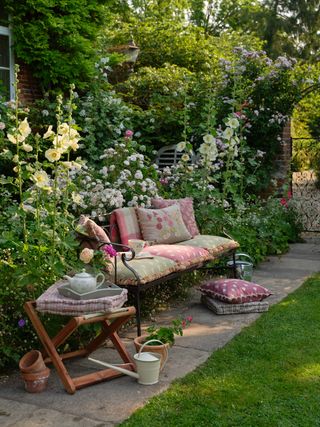 Susie Watson designs garden bench styled with cushions