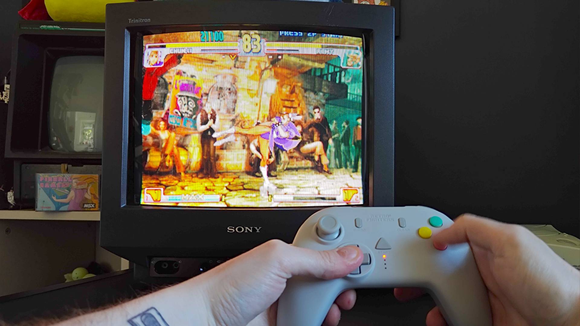 Phil Hayton using Retro Fighters StrikerDC to play Street Fighter Third Strike for Sega Dreamcast on Sony Trinitron CRT TV.