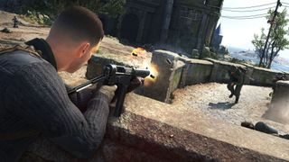 A soldier shoots from behind a low wall in Sniper Elite 5