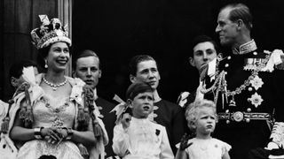 Queen Elizabeth II on the balcony of Buckingham Palace after her Coronation ceremony with (left to right); Prince Charles, Princess Anne and The Prince Philip, Duke of Edinburgh.