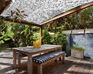 pergola with fabric roof and table set-up