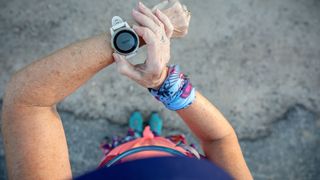 Woman starting a workout on fitness tracker