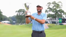 Scottie Scheffler of United States pose for pictures after winning the 2024 Travelers Championship on June 23, 2024, at TPC River Highlands in Cromwell, CT.