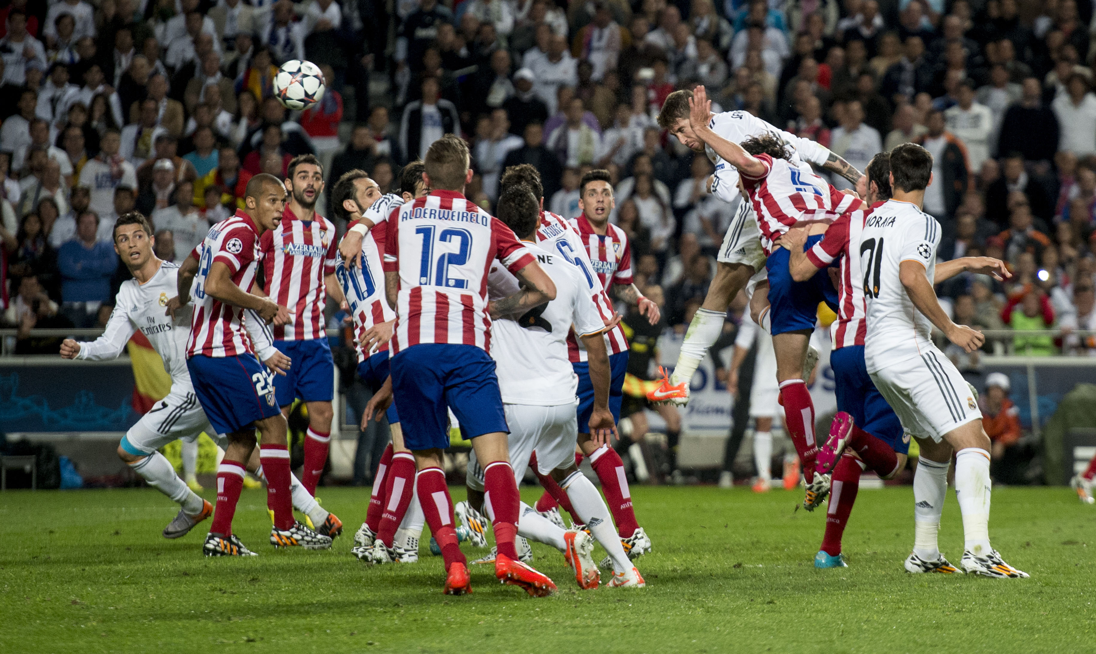 Sergio Ramos rises to head home a late equaliser for Real Madrid against Atletico Madrid in the 2014 Champions League final in Lisbon.