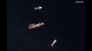 Ships involved in the search for the lost Titan submersible near the Titanic wreckage site.