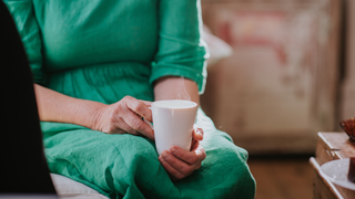 Woman talking with mug