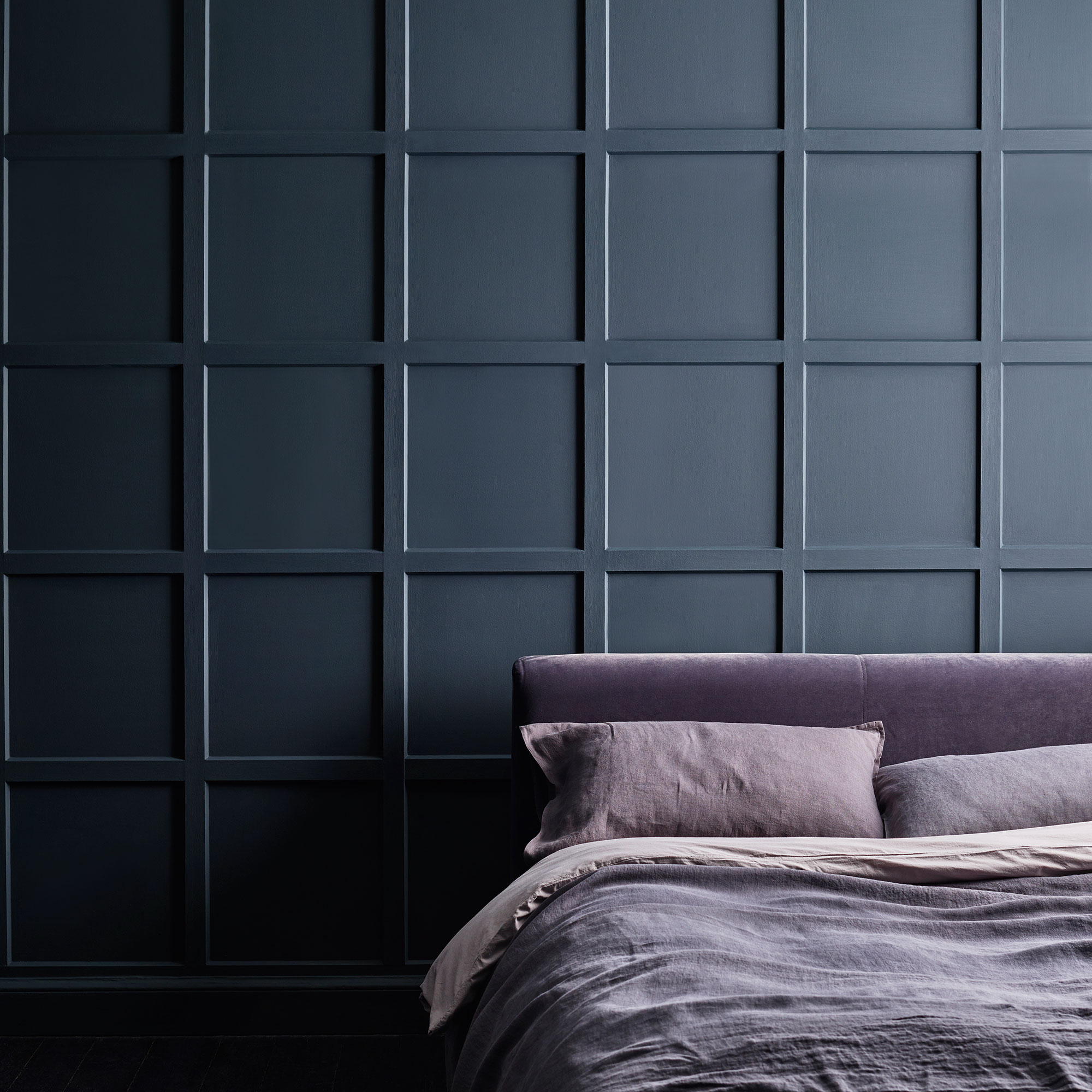 Blue bedroom with purple bedding