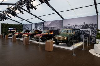 A row of Queen Elizabeth's cars in an exhibit in Rockefeller Center