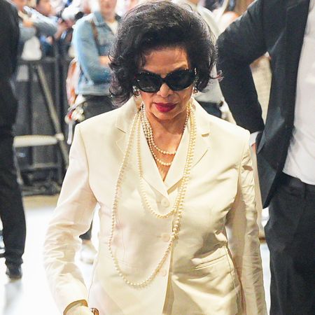 Bianca Jagger styled a bridal-white blazer and a matching pencil skirt at the Gucci Spring/Summer 2027 show at Milan Fashion Week