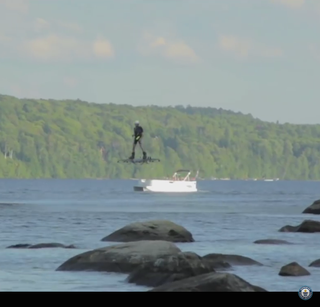 Screenshot of man on hoverboard.