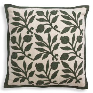 cushion with green crewel work patterns