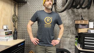 Guy in a Rider Resilience t-shirt