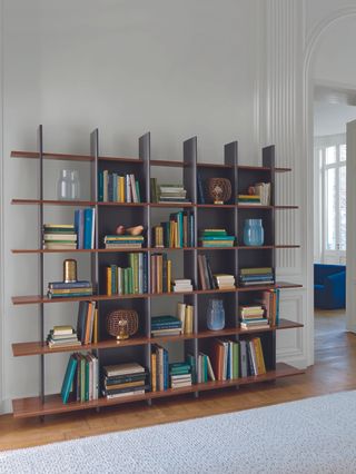 freestanding bookcase storage in grey hallway