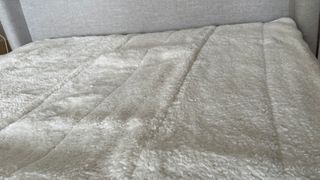 Dunelm Teddy Electric Blanket spread on a bed