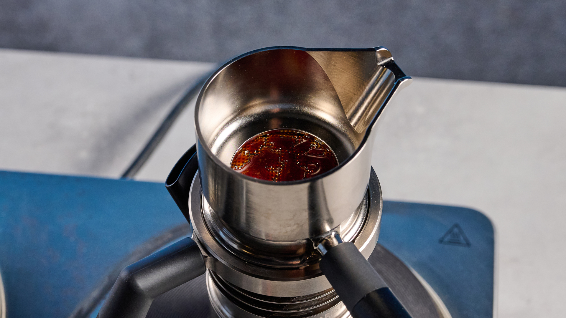 A photo of the 9Barista Espresso Machine Mk.2 against a blue background