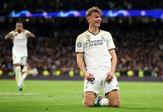 Nico Paz of Real Madrid celebrates after scoring the team's third goal during the UEFA Champions League match between Real Madrid and SSC Napoli at Estadio Santiago Bernabeu on November 29, 2023 in Madrid, Spain.