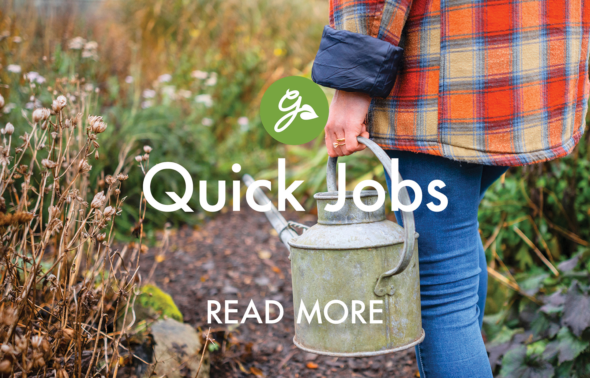 Read more about quick garden jobs in January that save time in spring. Image shows gardener carrying watering can in winter garden