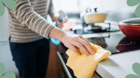  woman wiping counters in a kitchen to support expert guide of dirtiest items in your home