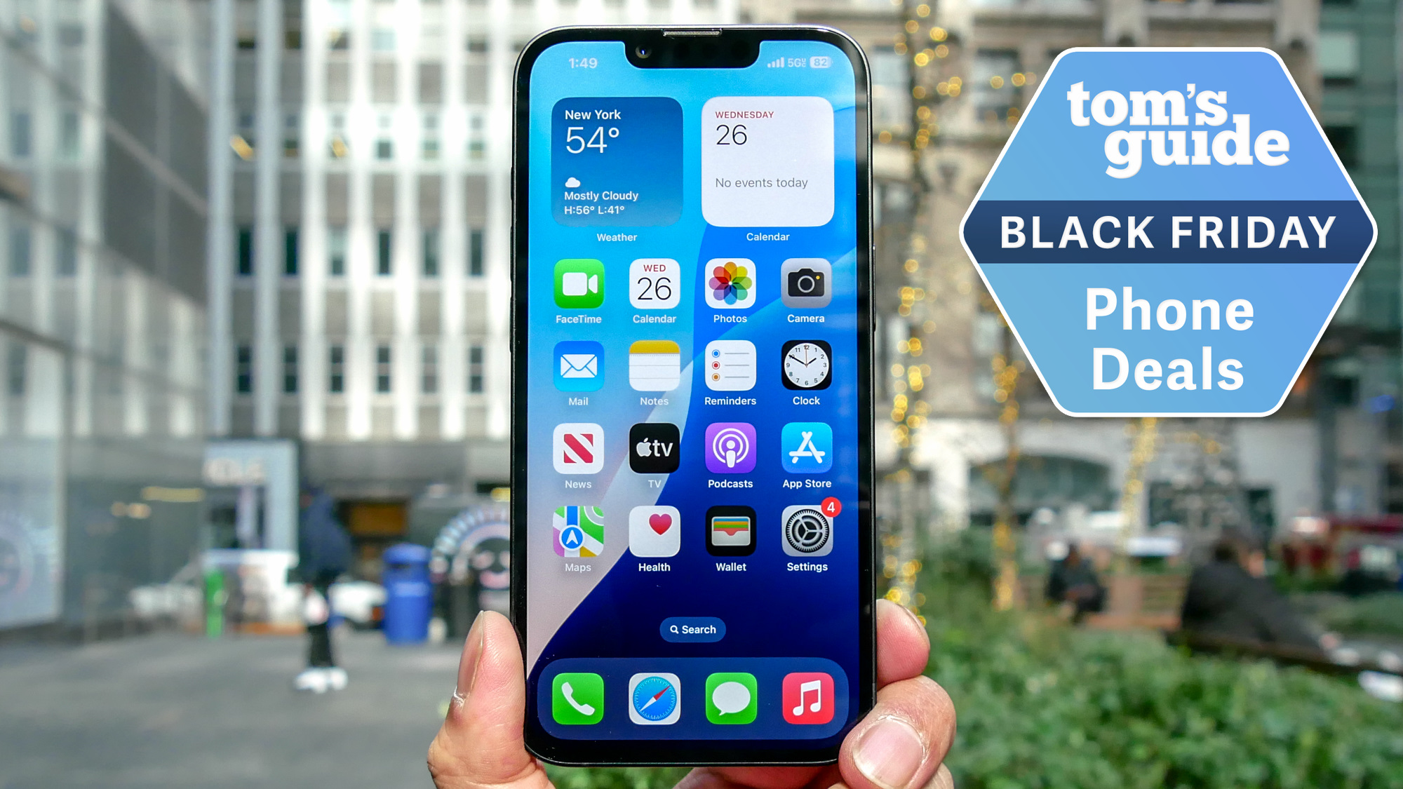 iPhone 16e held in the hand with Black Friday badge nearby.