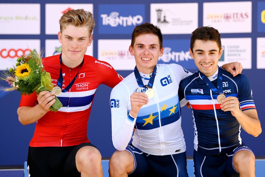 TRENTO ITALY SEPTEMBER 10 LR Silver medalist Per Strand Hagenes of Norway gold medalist Romain Gregoire of France and bronze medalist Lenny Martinez of France pose on the podium during the medal ceremony after 27th UEC Road Cycling European Championships 2021 Junior Mens Road Race a 1056 Km race from Trento to TrentoPiazza Duomo UECcycling on September 10 2021 in Trento Italy Photo by Justin SetterfieldGetty Images