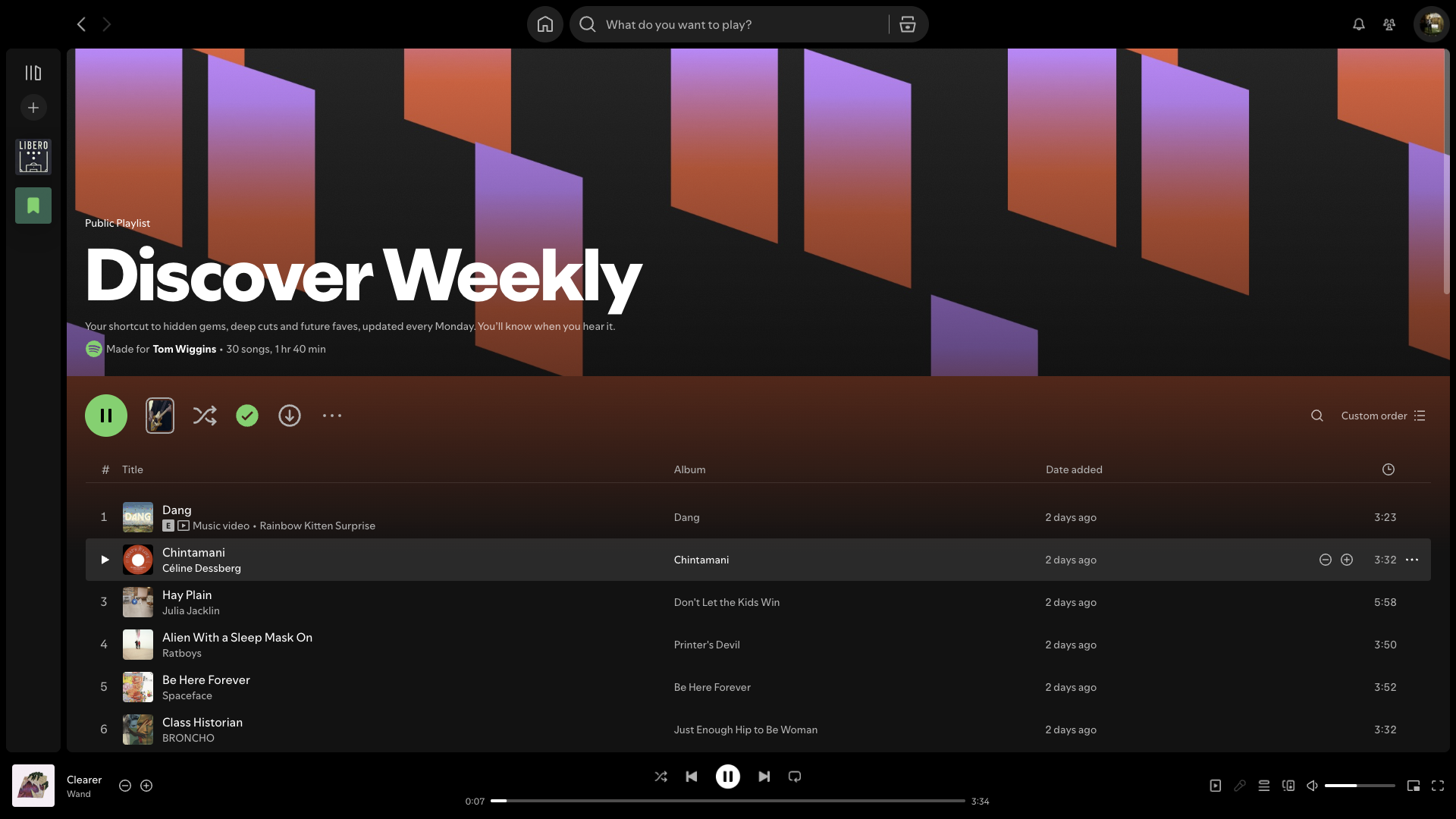 A screenshot of the desktop Spotify app showing a Discover Weekly playlist