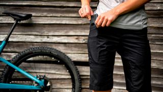 A man wearing MTB shorts