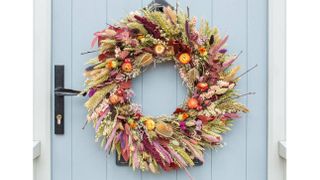 Autumn wreath made with dried flowers and grasses