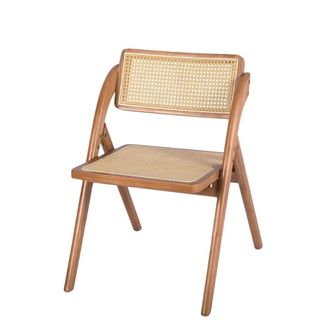 A dining room chair with cane back