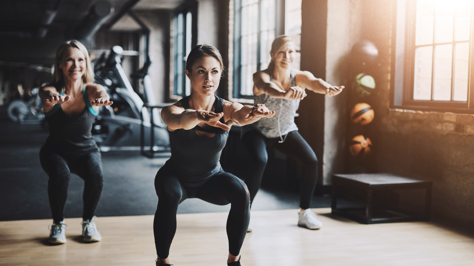 Women training together in gym