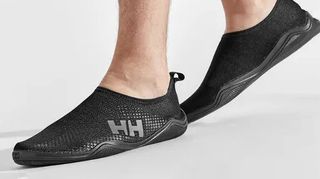 Man's feet wearing Helly Hansen Crest Watermoc shoes