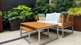 patio with channel drain, planters and garden furniture