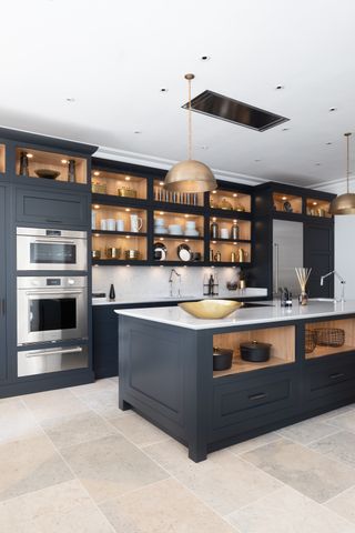 Charcoal kitchen island with deep-set drawers and open shelving compartments at top