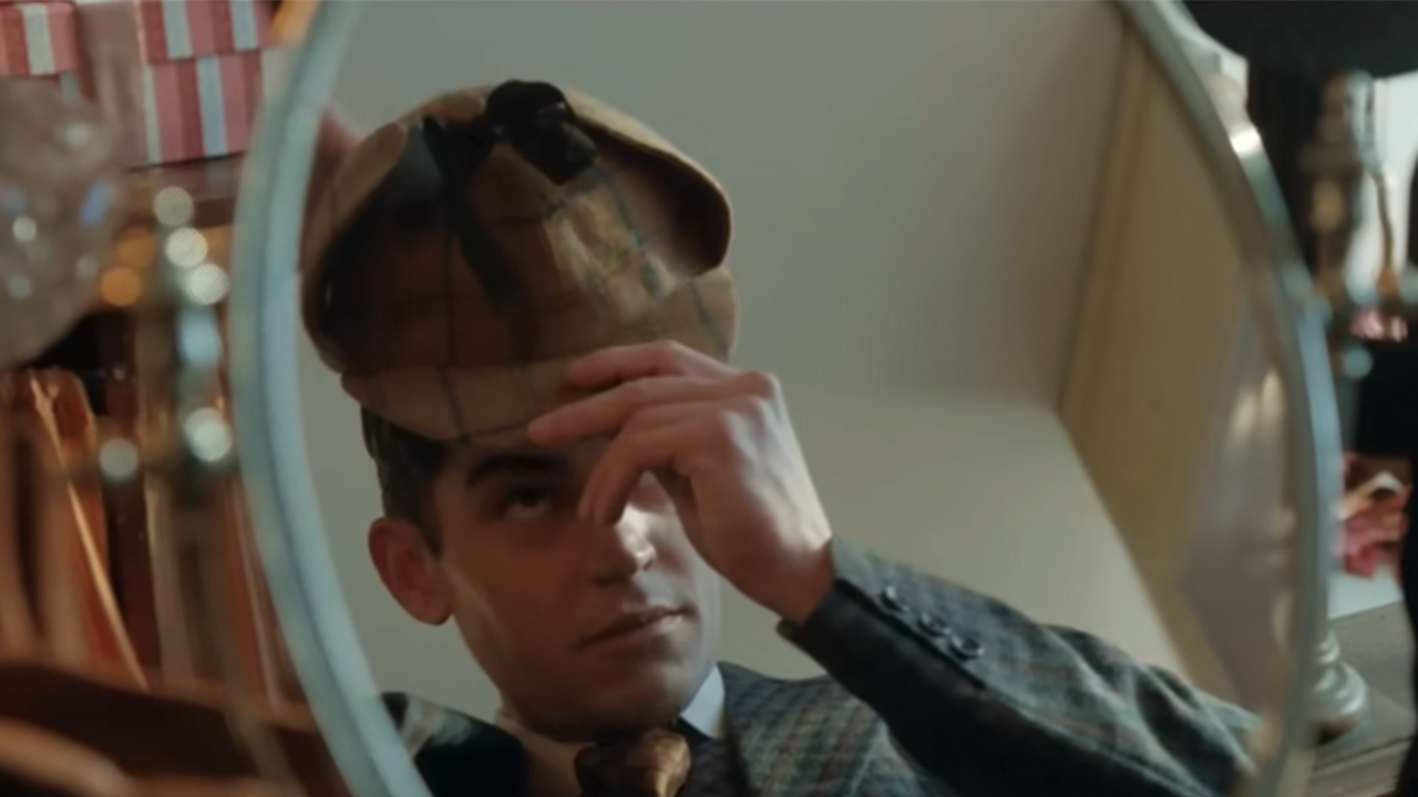 Hero Fiennes Tiffin trying on Sherlock Holmes famous hat in Young Sherlock Holmes